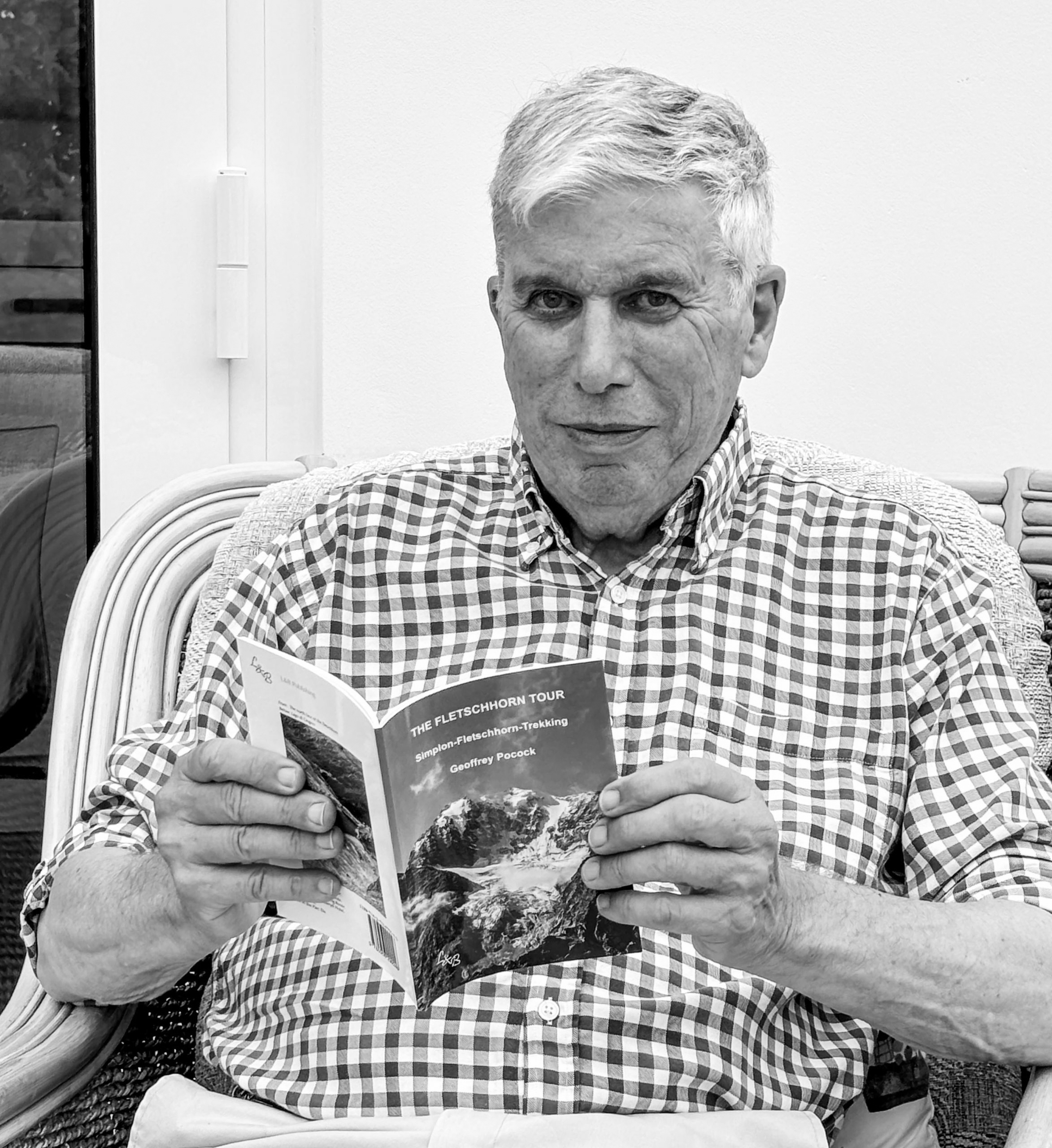 Geoffrey Pocock with his book Pen-Y-Gwryd Hotel