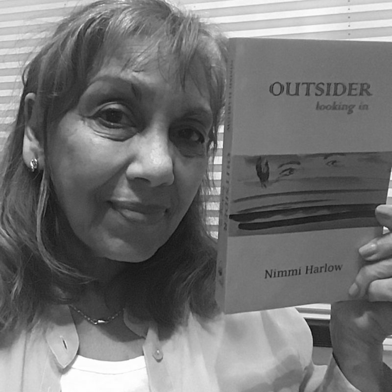 Nimmi Harlow with their book Outsider Looking In