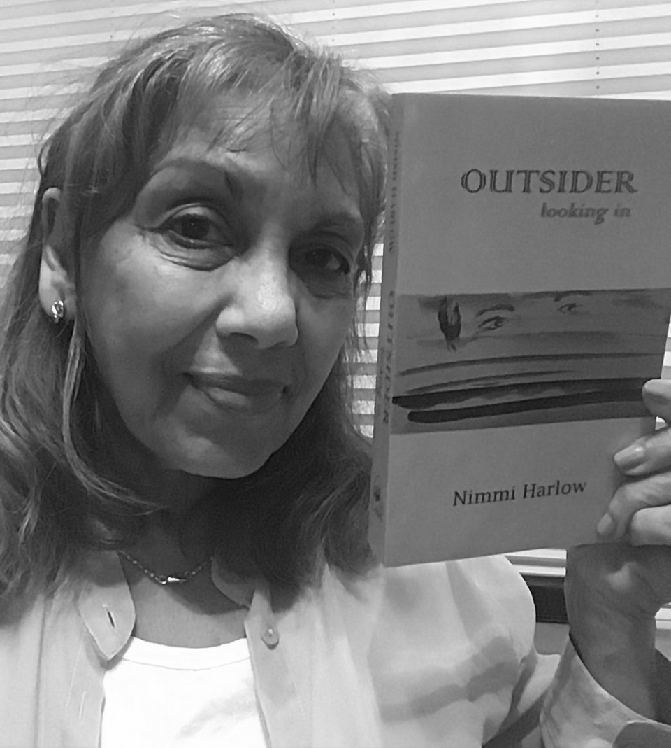 Nimmi Harlow with her book Outside Looking In