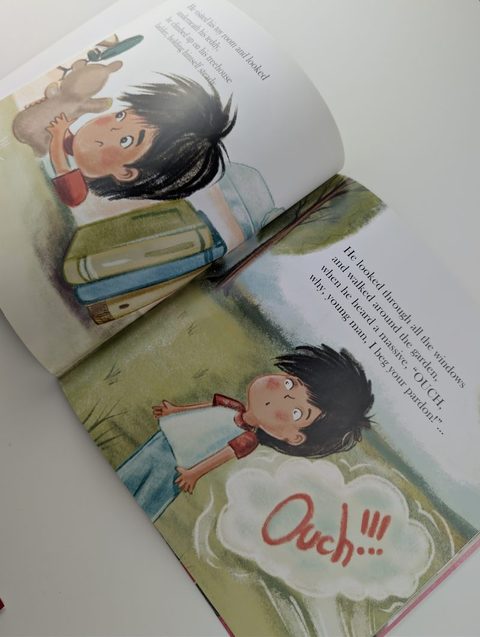 A children's picture book open flat to a full-colour spread