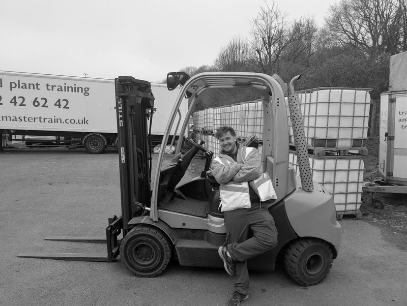 A team member on the forklift in the yard at the works, black and white