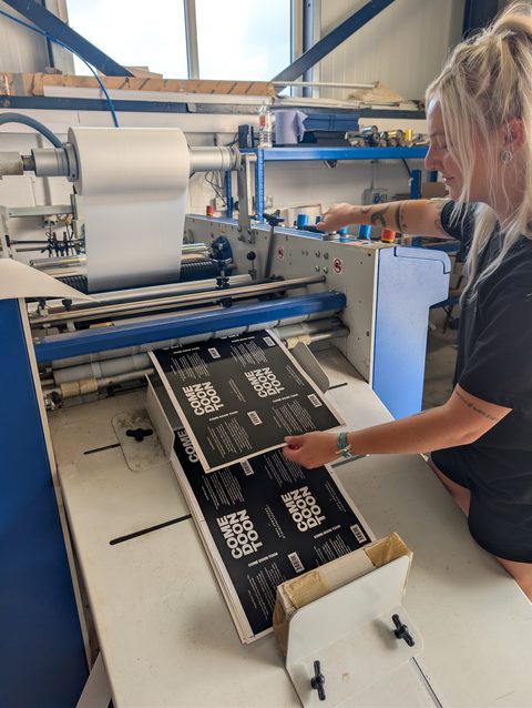 Printed covers going through the laminator