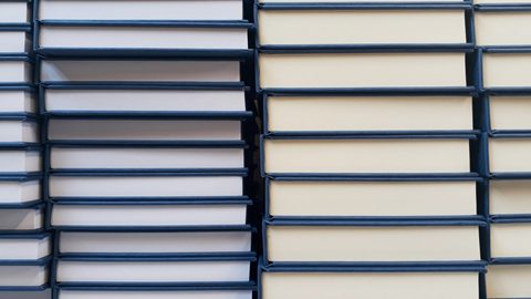 Navy hardbacks stacked after casing in