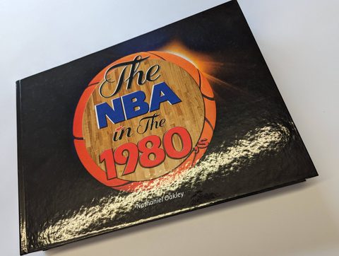 A landscape-format printed-case hardback with gloss lamination