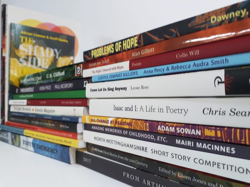 A pile of paperbacks from many publishers, spines to the camera