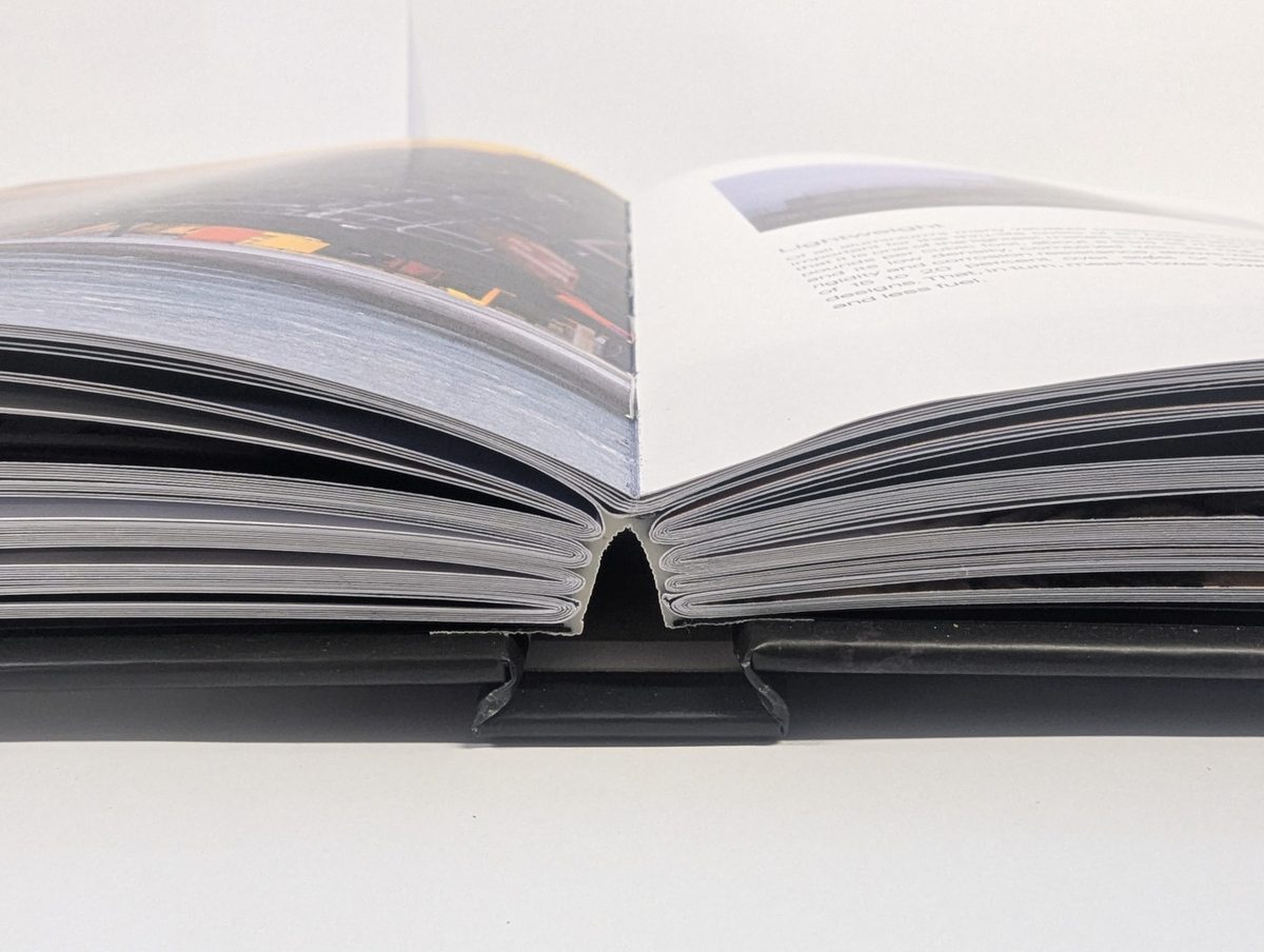 A sewn hardback lying open flat