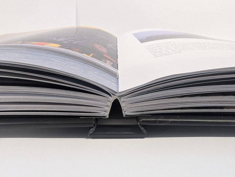 A sewn hardback lying open flat, the binding a diary needs