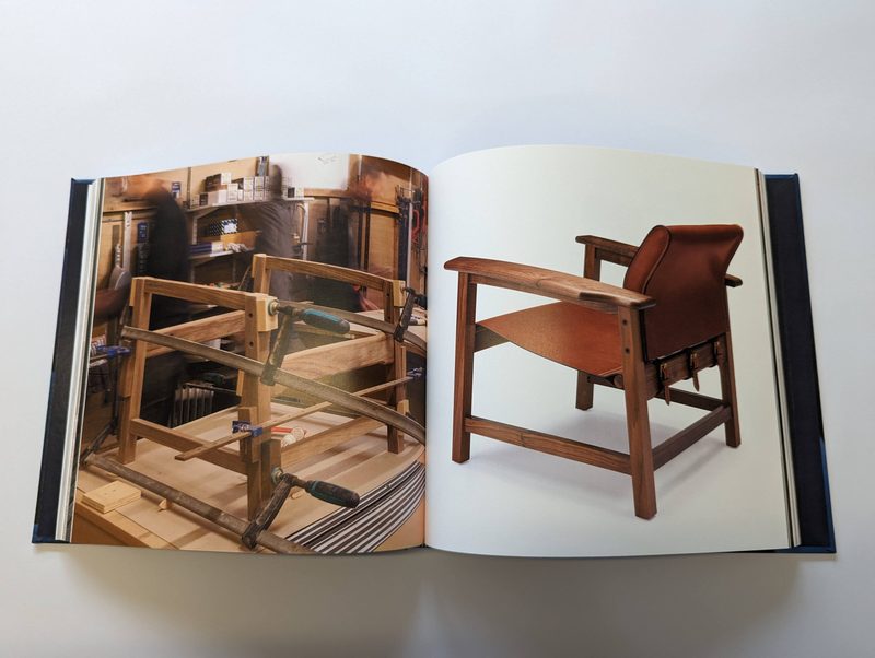 A printed catalogue open flat to a photographic spread, printed and bound at our Exeter works