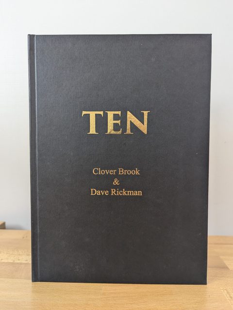 Gold foil title on black cloth