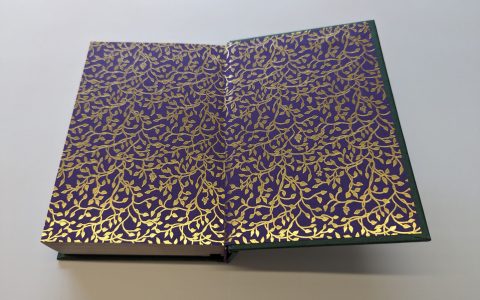 Full-colour printed endpapers inside the front board of a hardback